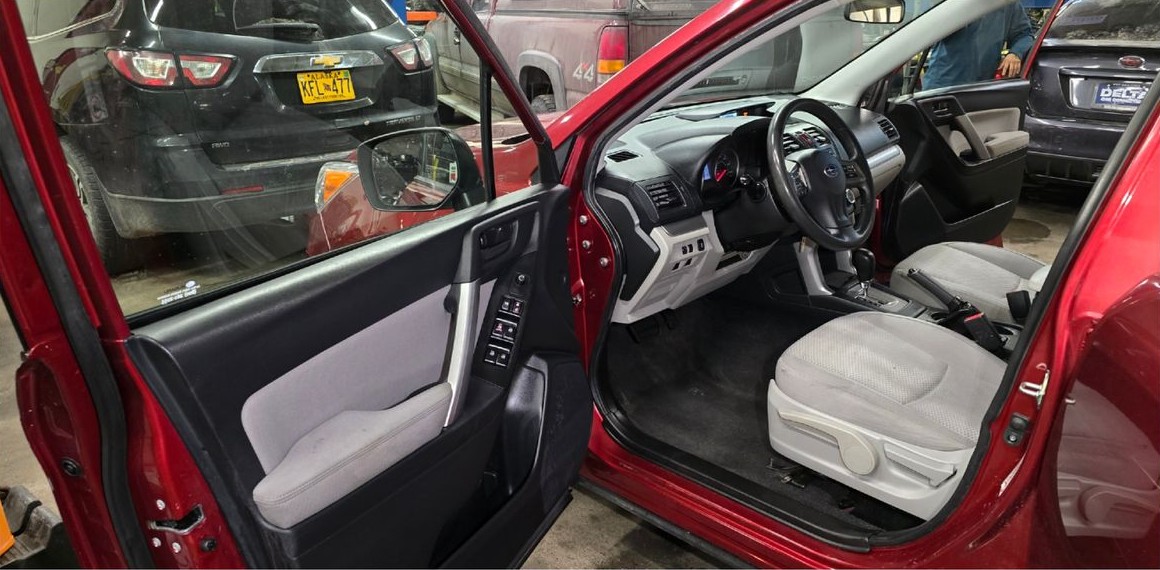 Front cabin after cleaning with clean seat, door panel and floor
