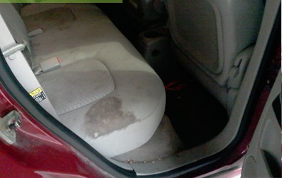 Rear seat before treatment with a large stain